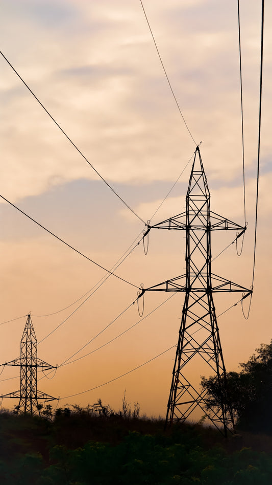 black electric tower under blue sky