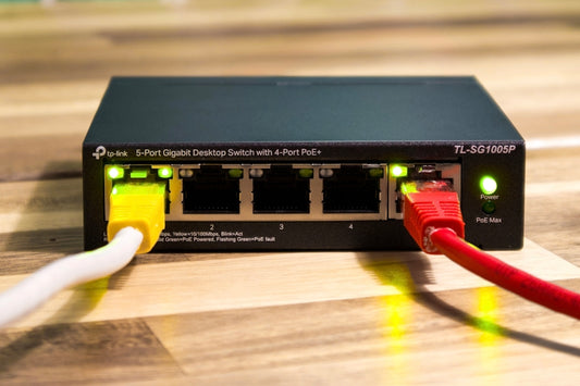 A network switch with ethernet cables connected.