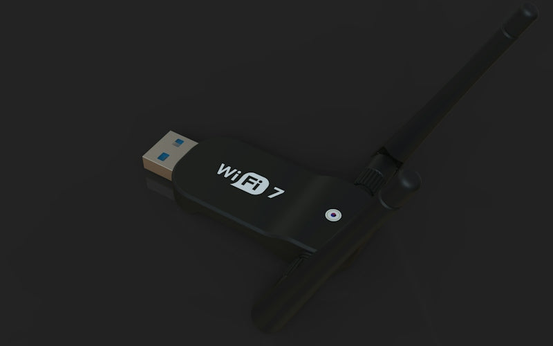 A black usb wifi 7 adapter with an antenna